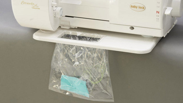 Baby Lock Serger Trim Bin attached to serger